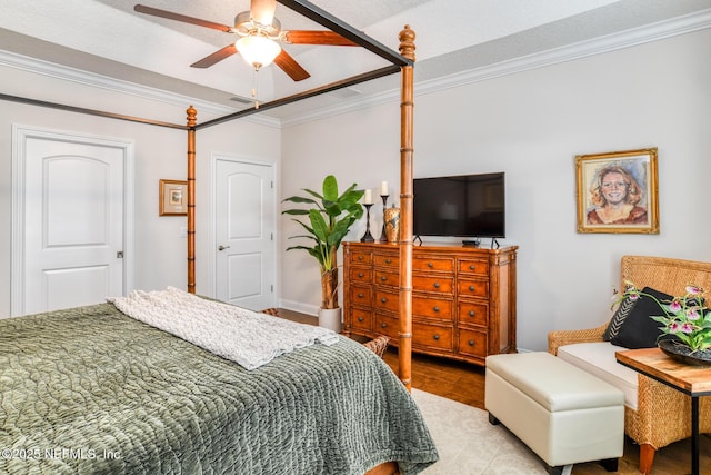 bedroom featuring light wood-type flooring, crown molding, and ceiling fan