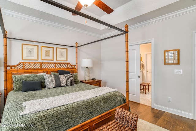 bedroom with a textured ceiling, ornamental molding, ceiling fan, and wood-type flooring