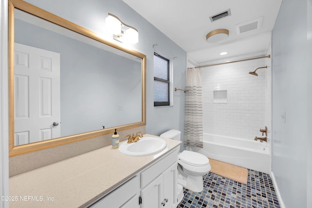 bathroom featuring visible vents, vanity, toilet, and shower / bath combo with shower curtain