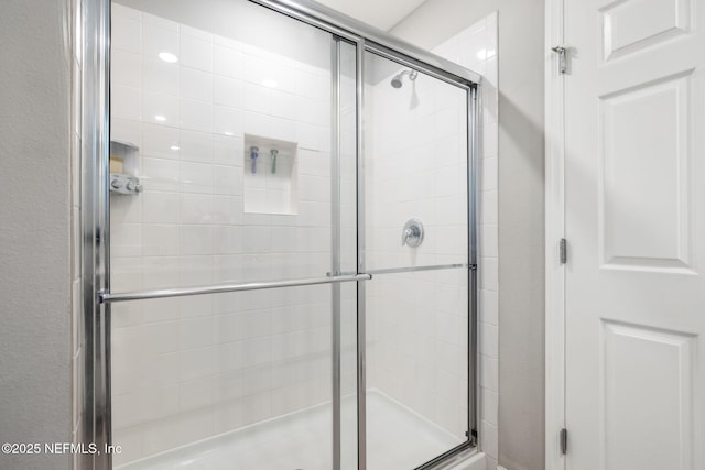 bathroom featuring a shower stall