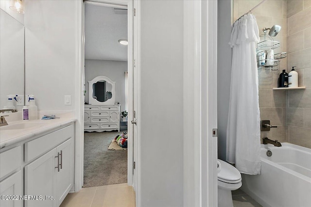 full bathroom with vanity, tile patterned floors, toilet, and shower / bath combo with shower curtain