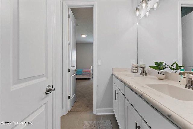 bathroom with vanity and tile patterned floors