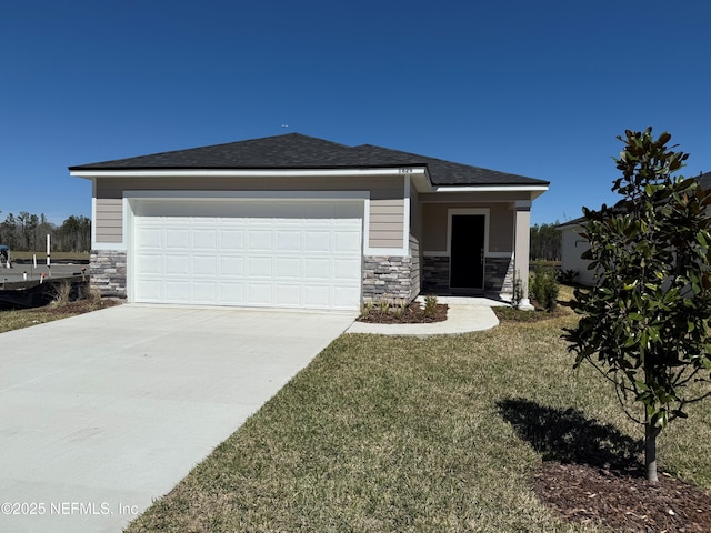 view of front of house with stone siding, an attached garage, concrete driveway, and a front yard