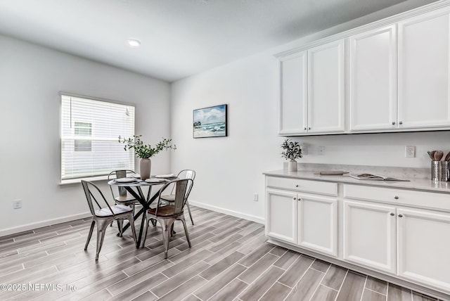 dining area featuring recessed lighting, baseboards, and wood finish floors