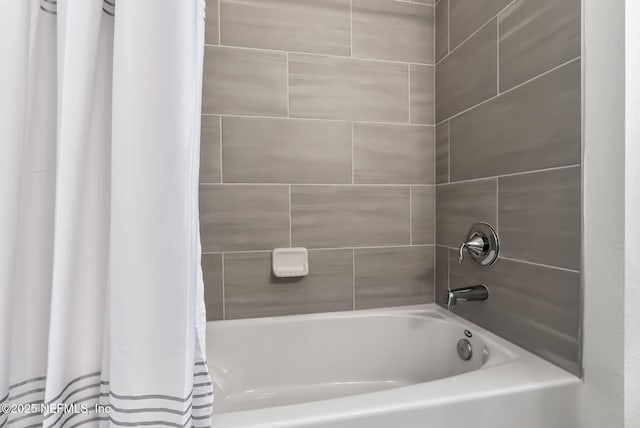 bathroom featuring shower / bath combo with shower curtain