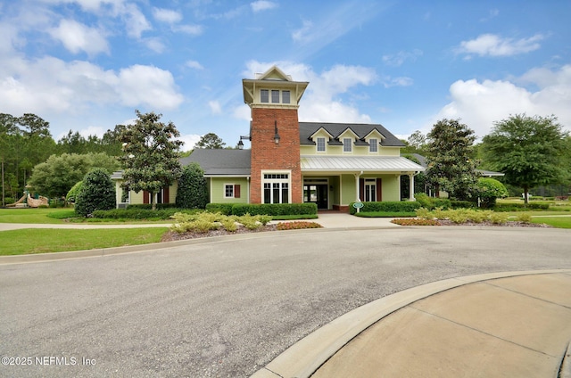 view of front of property featuring a standing seam roof and metal roof