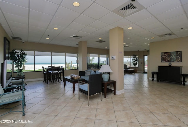 community lobby featuring visible vents and a water view