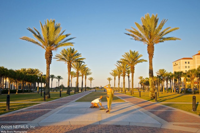 surrounding community featuring a yard