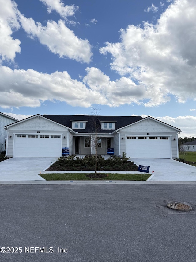 view of front of house with a garage and concrete driveway