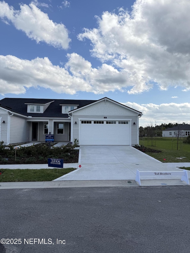 view of front of property with driveway and an attached garage