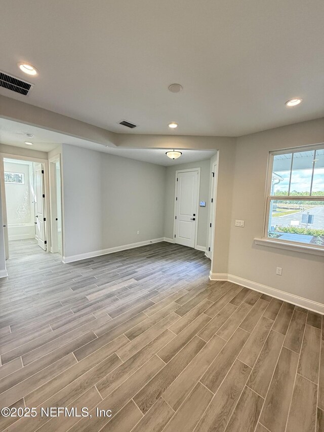 15 Wimbledon Way, Palm Coast, FL 32164 - unfurnished room with visible vents, recessed lighting, baseboards, and wood tiled floor