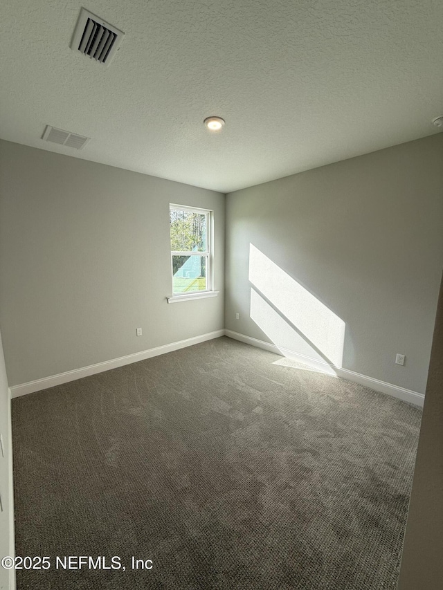 15 Wimbledon Way, Palm Coast, FL 32164 - carpeted empty room featuring baseboards, visible vents, and a textured ceiling