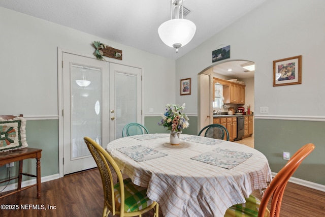 37069 Lee St, Hilliard, FL 32046 - dining area featuring sink, dark wood-type flooring, and vaulted ceiling