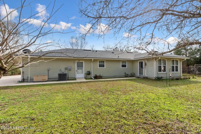 37069 Lee St, Hilliard, FL 32046 - back of house with central AC unit and a lawn
