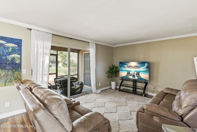 living area with ornamental molding, baseboards, and wood finished floors