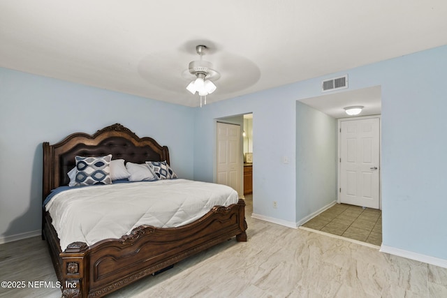 bedroom with baseboards, a closet, visible vents, and a ceiling fan