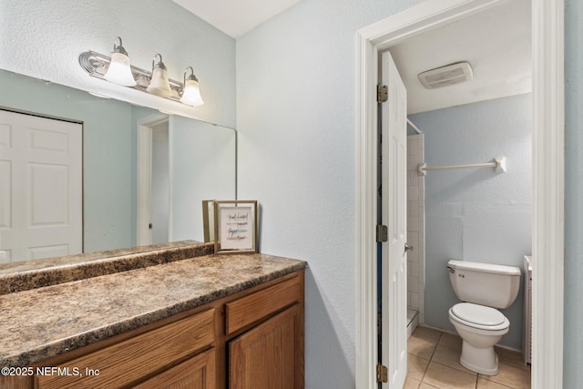 full bath featuring visible vents, toilet, tile patterned floors, walk in shower, and vanity