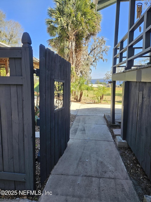 view of gate featuring fence