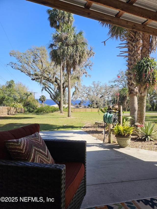 view of patio featuring fence