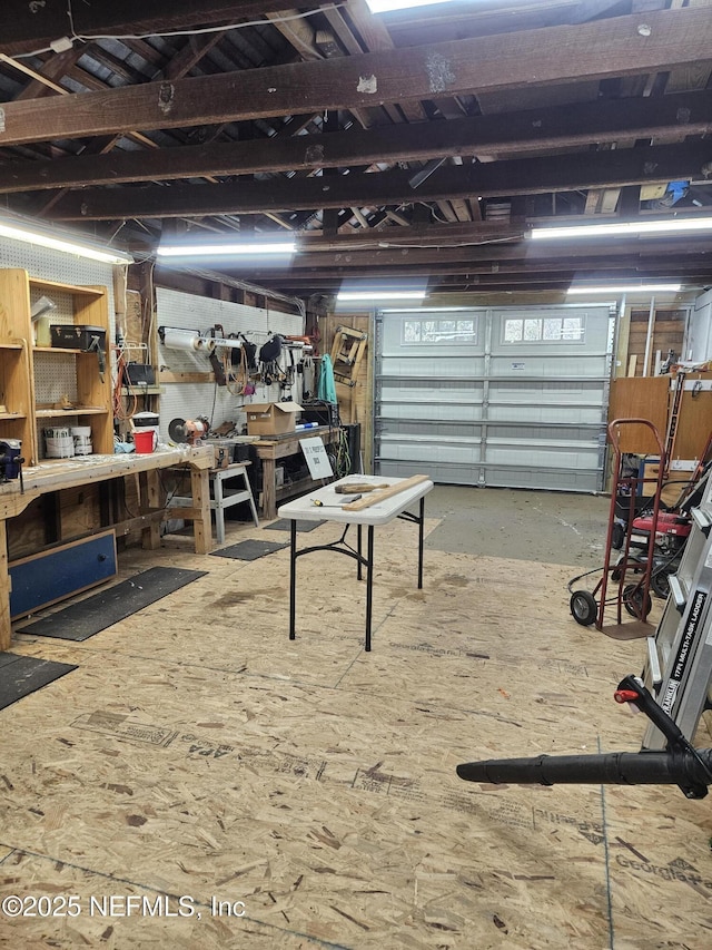 garage with a workshop area