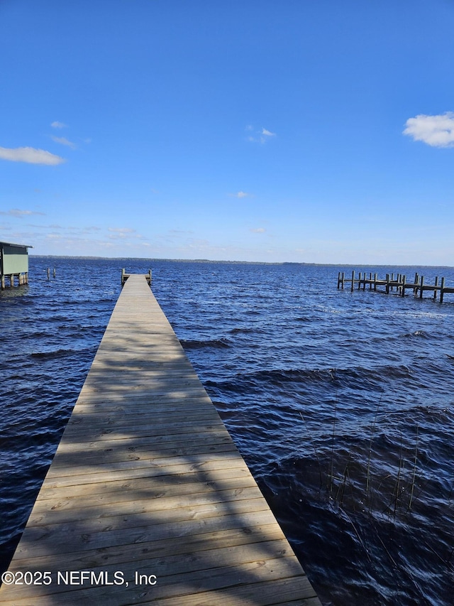 view of dock with a water view