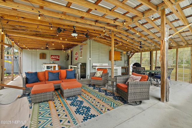 view of patio / terrace featuring ceiling fan and an outdoor living space