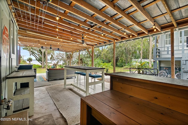 view of patio / terrace featuring ceiling fan and outdoor dining space