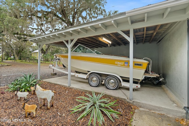 view of parking / parking lot featuring a carport