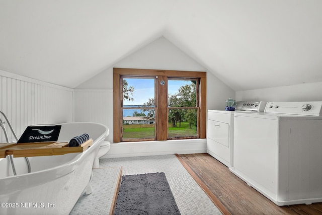 interior space with washing machine and clothes dryer and wood finished floors