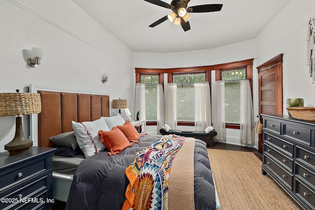 bedroom with a ceiling fan and wood finished floors