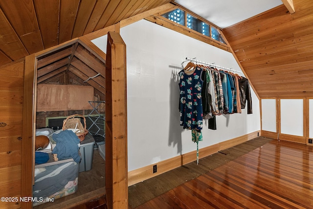 spacious closet featuring lofted ceiling and hardwood / wood-style floors