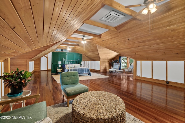 bedroom with lofted ceiling with beams, wood walls, wood ceiling, visible vents, and wood-type flooring