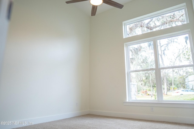 unfurnished room with ceiling fan and carpet floors