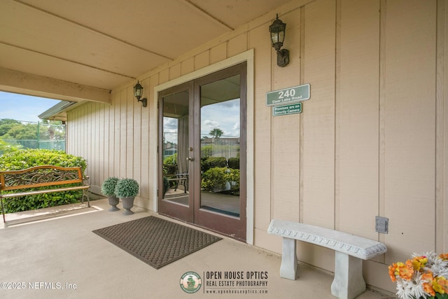 entrance to property with french doors and board and batten siding