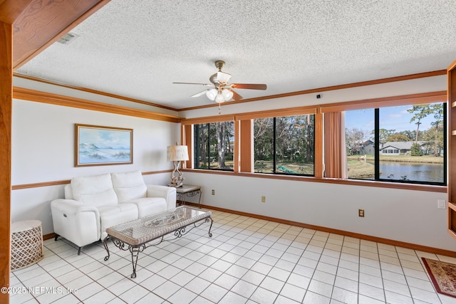 unfurnished living room with light tile patterned floors, visible vents, ornamental molding, a water view, and a textured ceiling