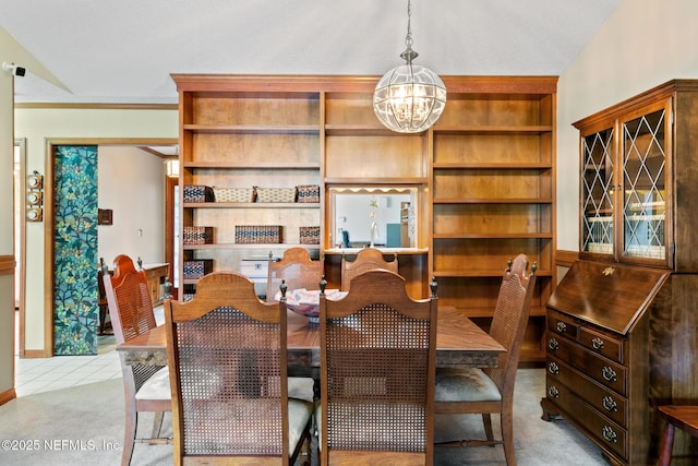 dining room with light tile patterned floors, light colored carpet, and an inviting chandelier