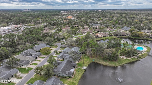 bird's eye view with a water view and a residential view