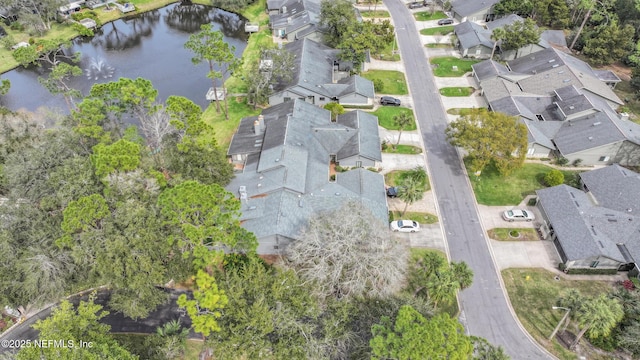 aerial view with a residential view and a water view