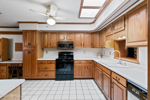 kitchen featuring brown cabinets, light countertops, electric range, a sink, and dishwasher