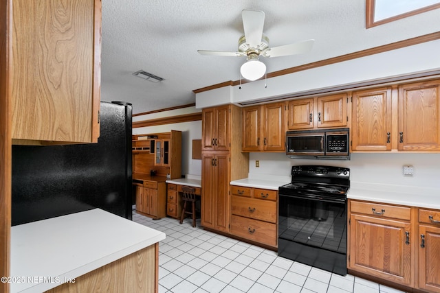 kitchen with visible vents, ornamental molding, light countertops, a textured ceiling, and black appliances