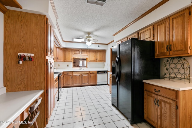 kitchen with crown molding, light countertops, black appliances, and brown cabinets