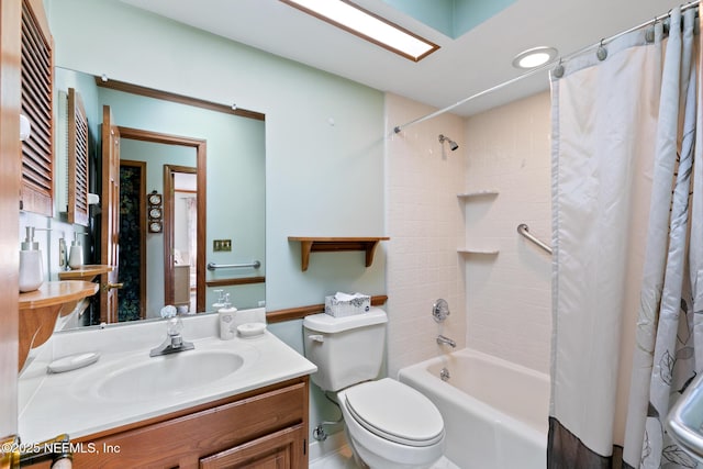 full bathroom with shower / bath combo, vanity, and toilet