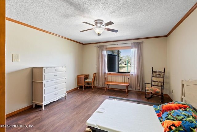 bedroom featuring dark wood-style floors, ornamental molding, a ceiling fan, a textured ceiling, and baseboards