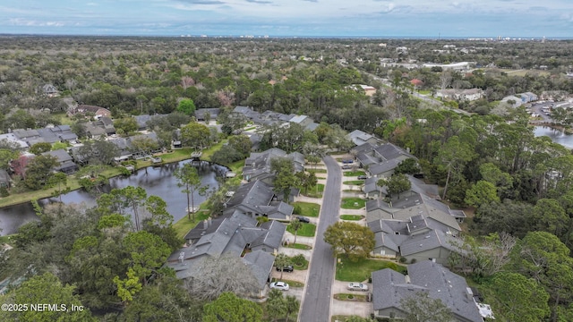 birds eye view of property featuring a water view and a residential view