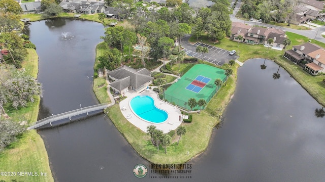 bird's eye view with a residential view and a water view