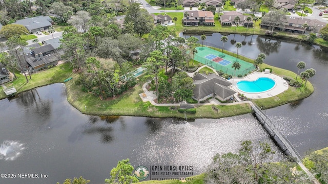 birds eye view of property featuring a water view and a residential view