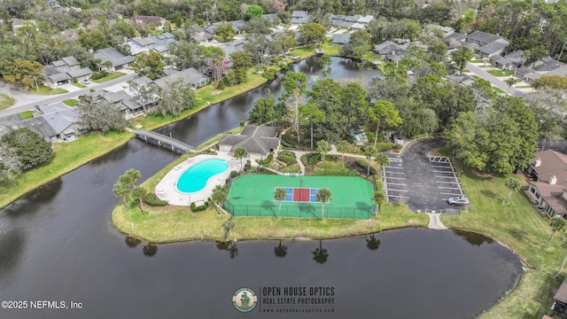 birds eye view of property with a residential view and a water view