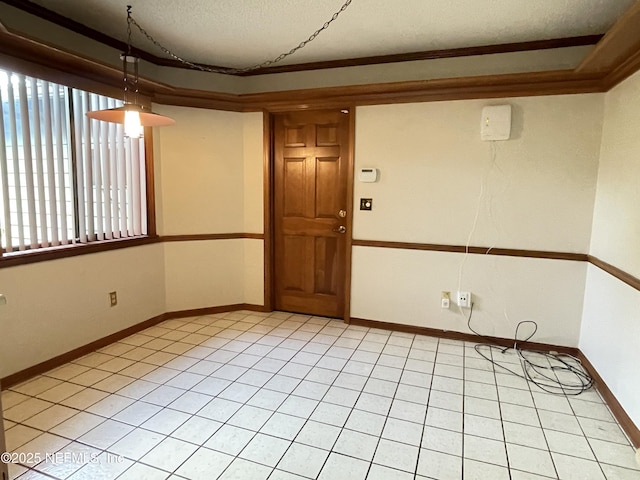 195 Deer Lake Cir, Ormond Beach, FL 32174 - spare room featuring a textured ceiling, light tile patterned floors, crown molding, and baseboards