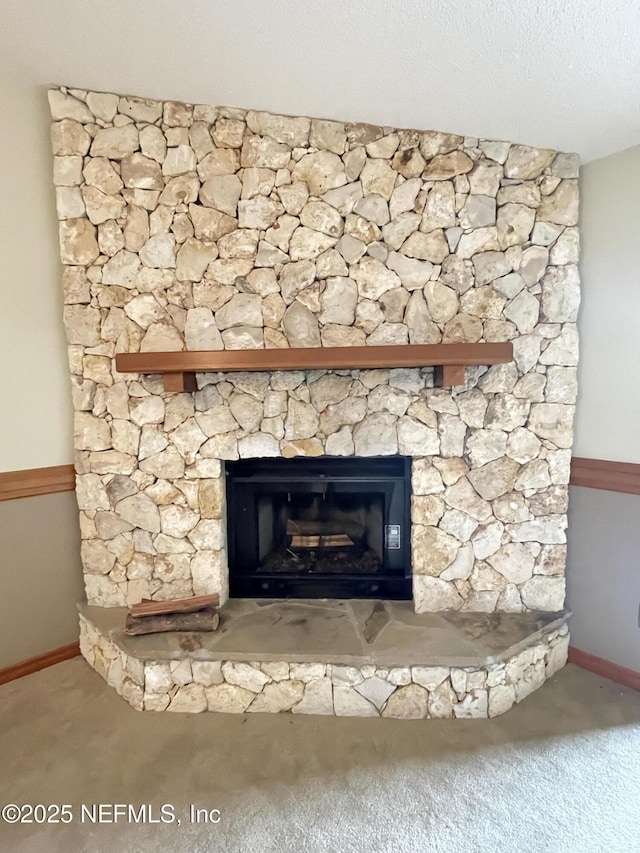 195 Deer Lake Cir, Ormond Beach, FL 32174 - detailed view of carpet flooring, a stone fireplace, and baseboards