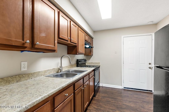 kitchen with sink, black appliances, and dark hardwood / wood-style floors